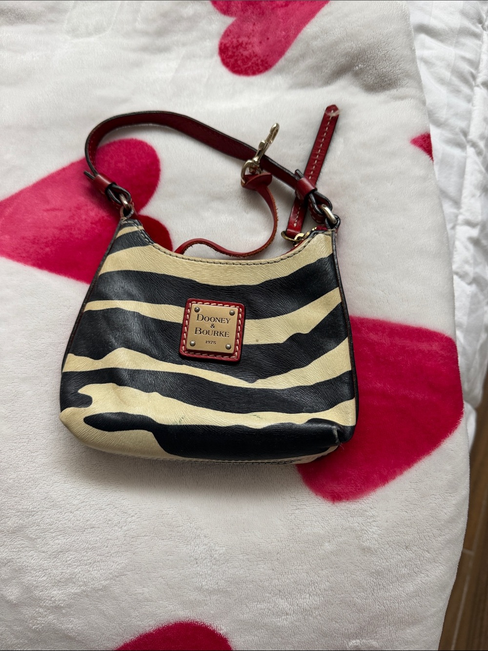 Dooney & Bourke Black and Cream Zebra-Print Mini Shoulder Bag with Red Trim